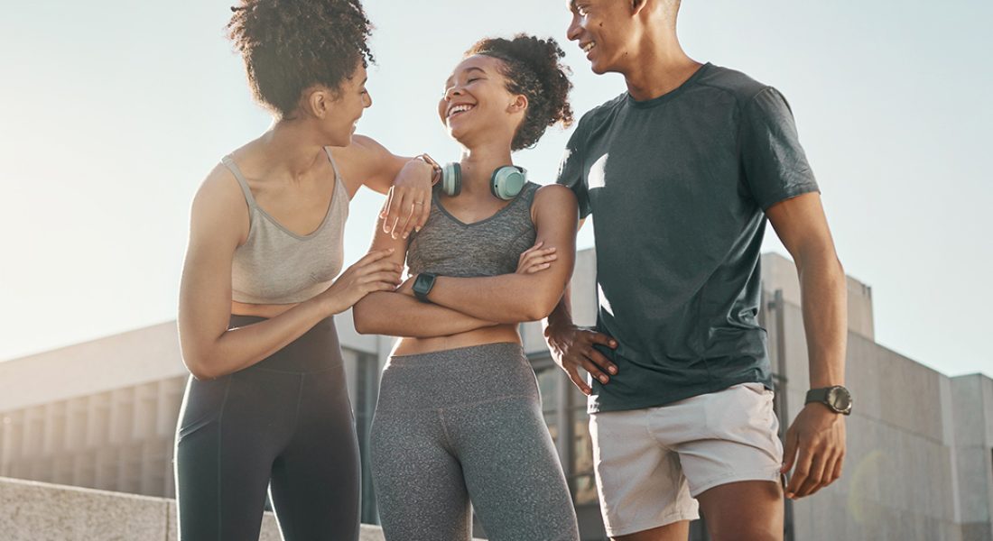 city running friends, group smile and laugh together on road aft